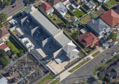 An aerial view of a Hurstville Residential Metal Roofing house in a suburb.